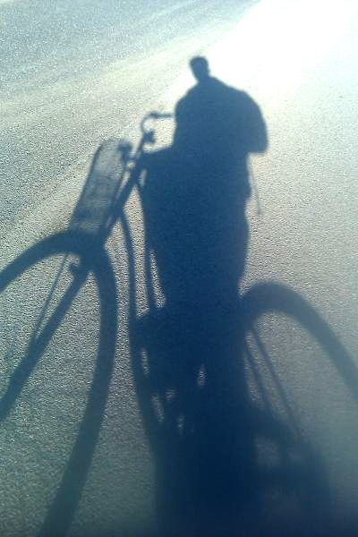 Shadow of a girl on a bike