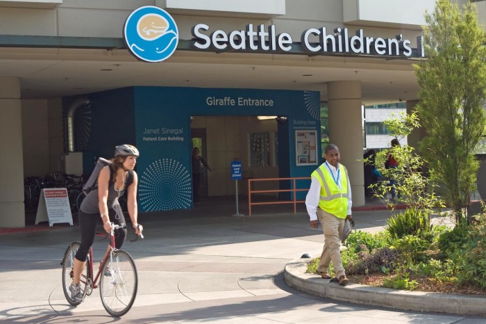 An employee bikes home from Seattle Children's Hospital, a Platinum level Bicycle Friendly Business