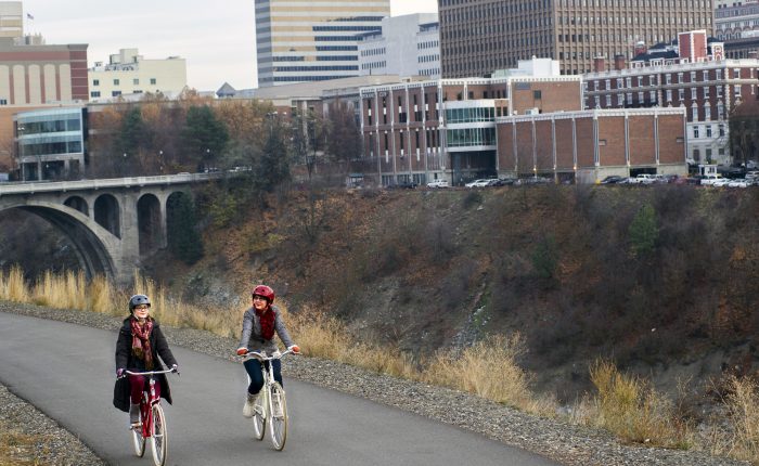 Lynn Ellis, left, and Patti Nepean, co-owners of MonkeyBoy Bicycles go for a ride on Tuesday, Nov. 18, 2014, at Kendall Yards in Spokane, Wash. TYLER TJOMSLAND tylert@spokesman.com