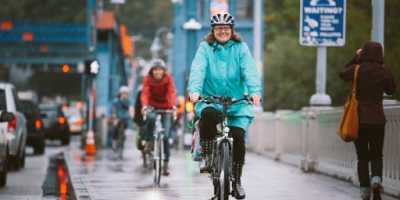 A woman rides across the Fremont Bridge