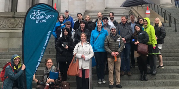 Participants in Washington Bikes' 2020 Lobby Day stand on the capitol steps in Olympia.