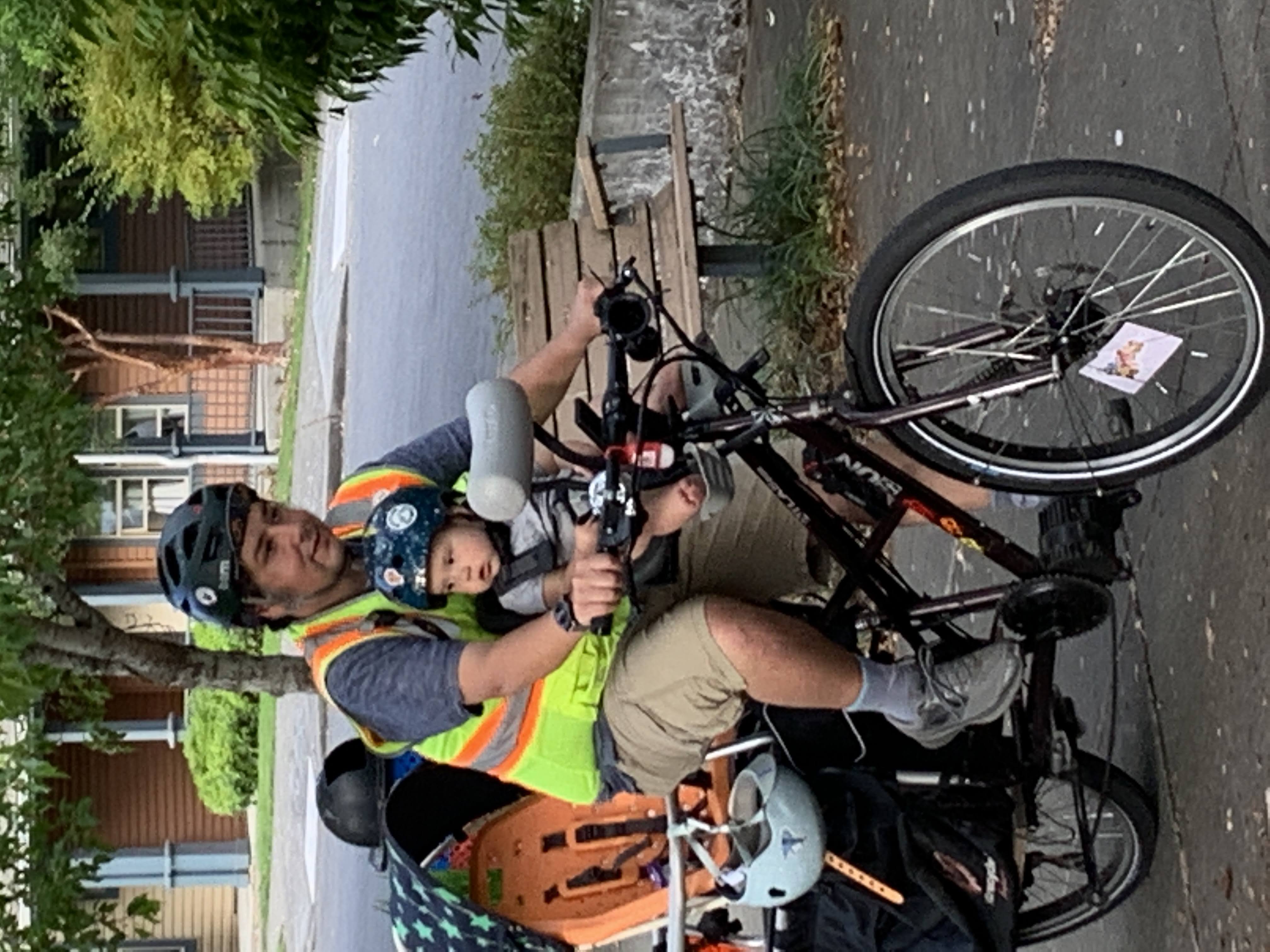 Sal Ponce rides with his daughter on his e-cargo bike